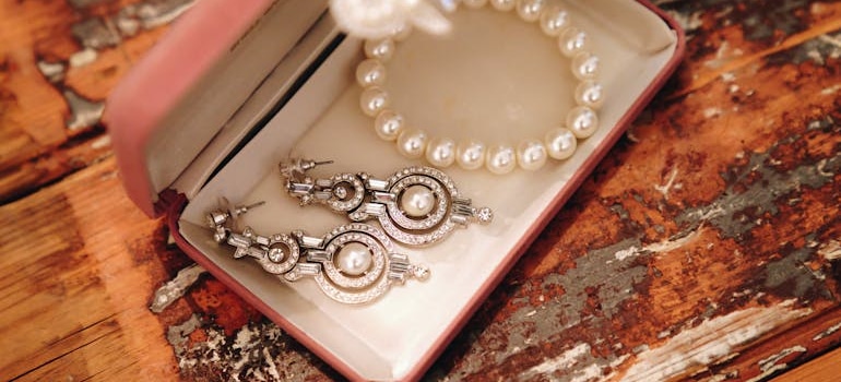 Close-up Photo of Pearl Necklace and Earings