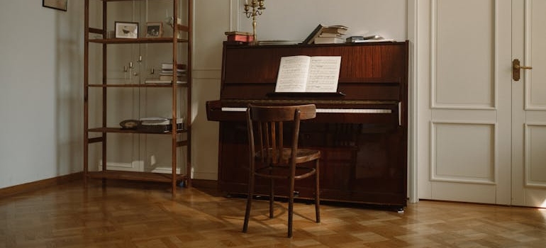 a piano next to a white door 