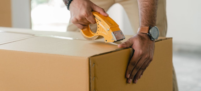 a man packing a box 