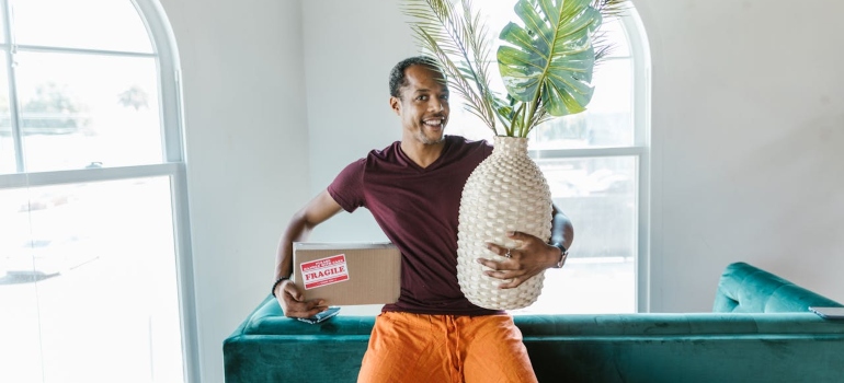 a man preparing stuff for Household Goods Shipping 