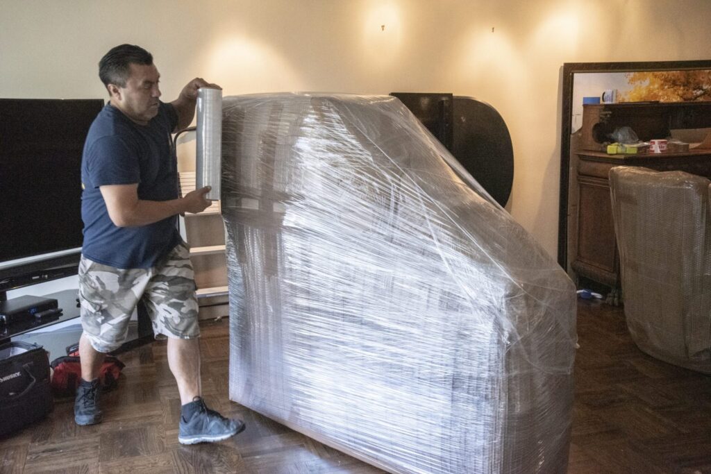 mover wrapping a piano