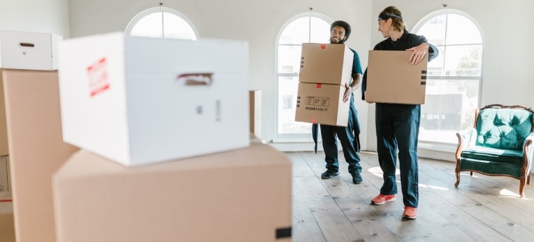 movers carrying boxes for moving to japan