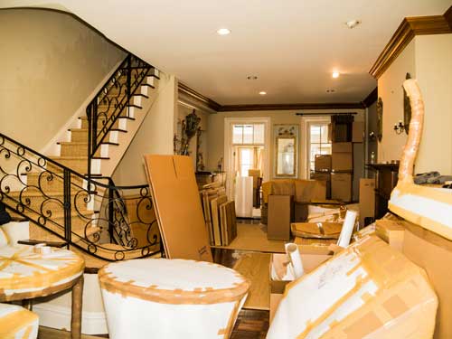 living room filled with boxes