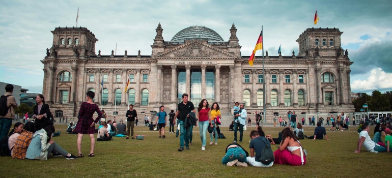 people sitting in the park after moving to Germany