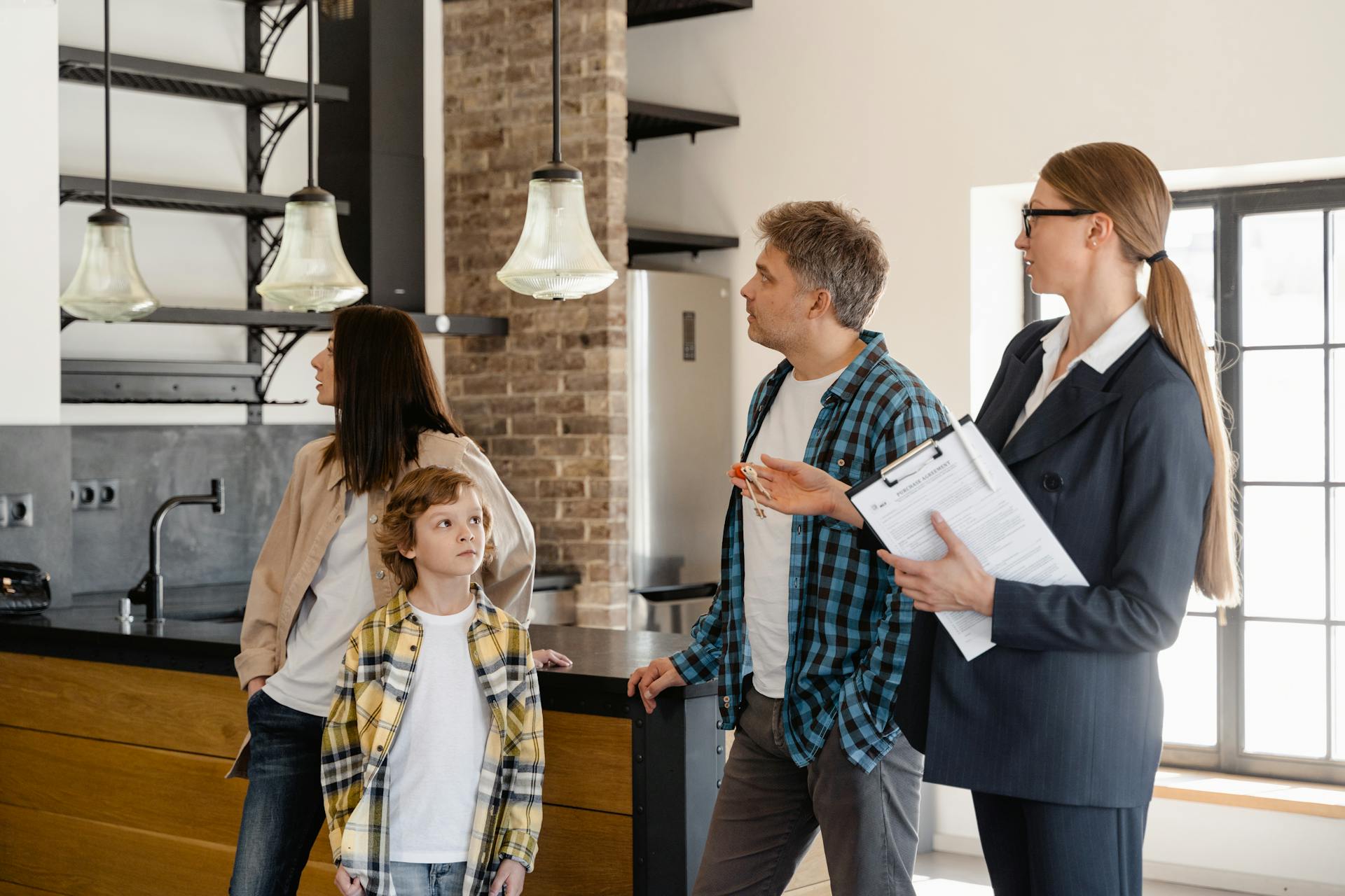 a family discussing lease agreements with a realtor