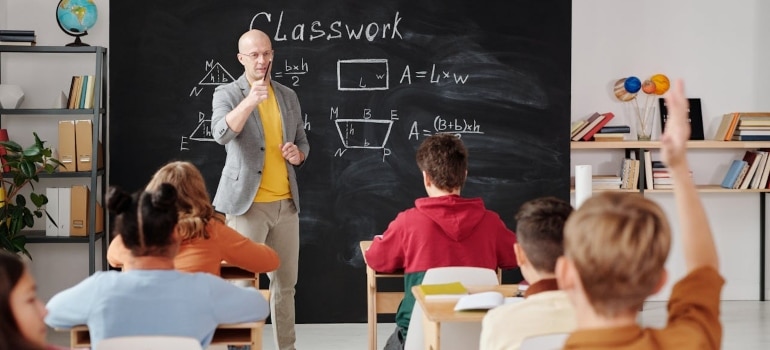 a man teaching kids in the classroom 