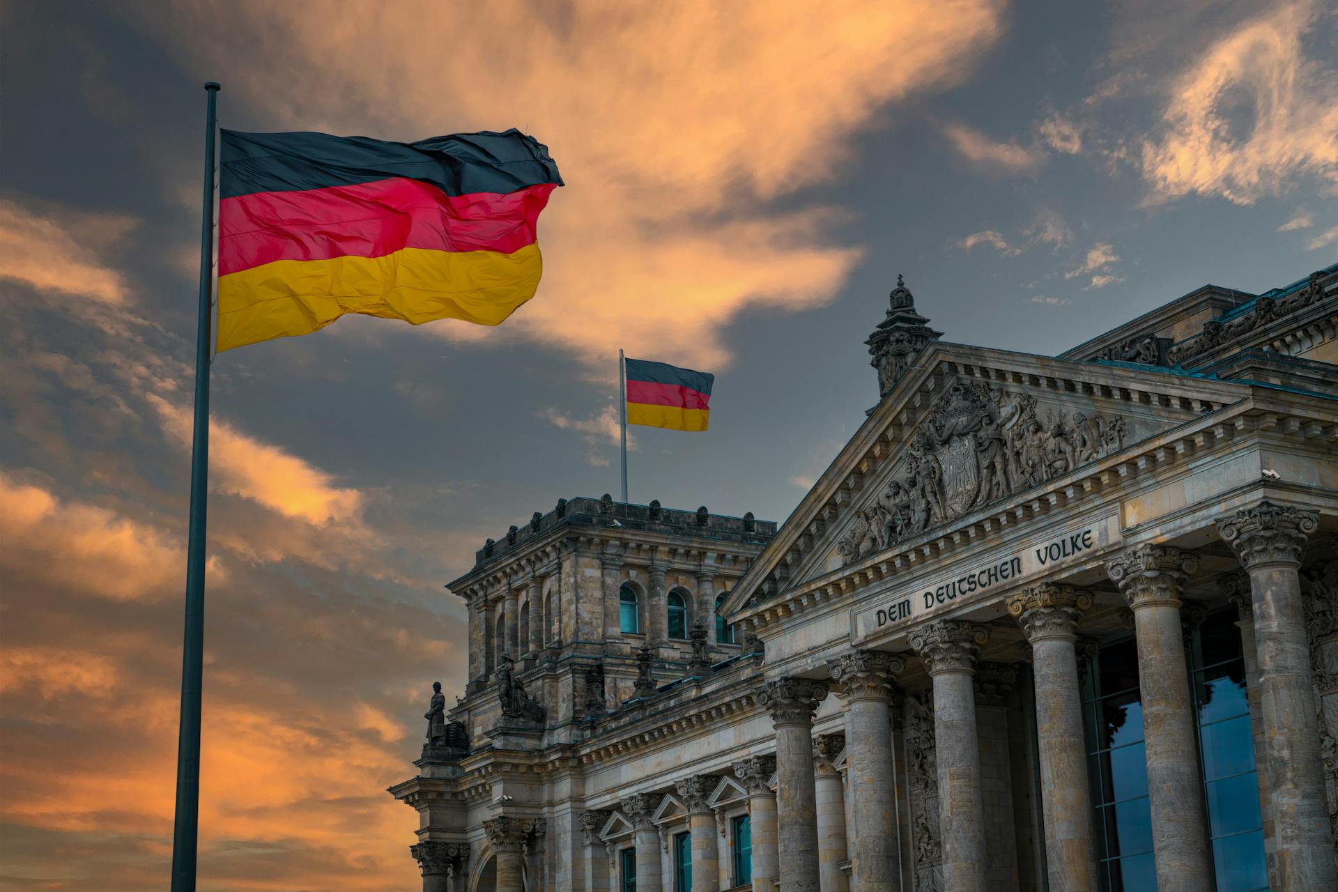 a German flag in front of a building