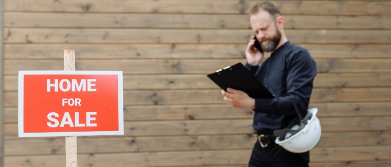 real estate agent looking at sale documents 