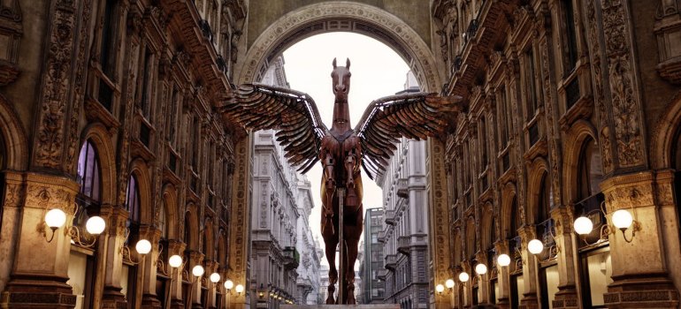 A striking sculpture of a winged horse in Milan’s Galleria Vittorio Emanuele II, symbolizing the city’s artistic and fashion-forward spirit.