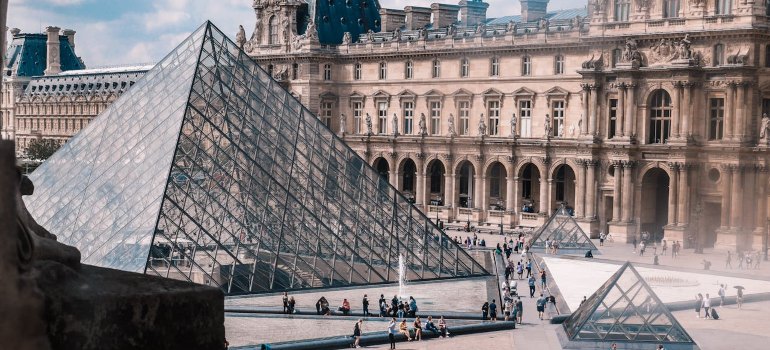 The Louvre Pyramid in Paris, where art and fashion intertwine, making it a must-visit in European Cities for Fashion Designers.