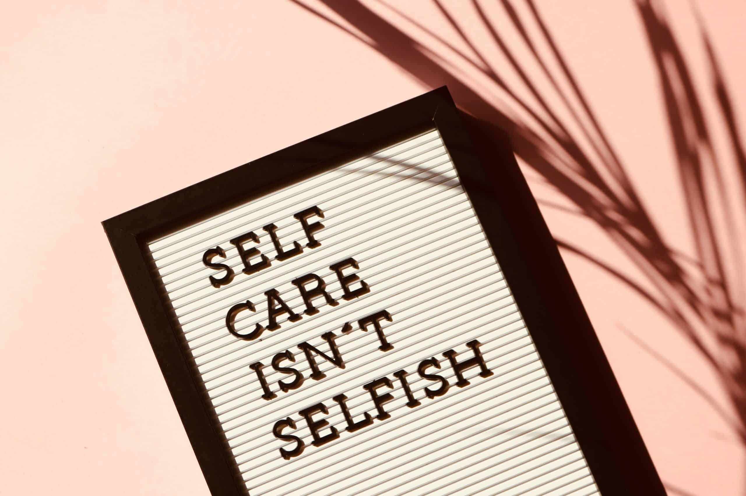 A frame with a photo that says "SELF CARE ISN'T SELFISH"
